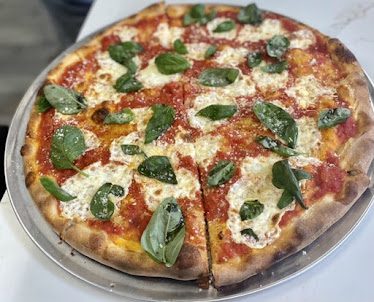Paulie's Kitchen + Pizza — Restaurant Food And Dining Photo