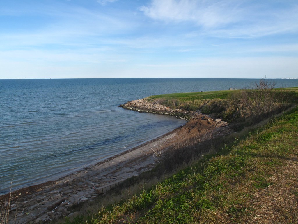 Rocky shoreline and bay water at Cole Park in Corpus Christi